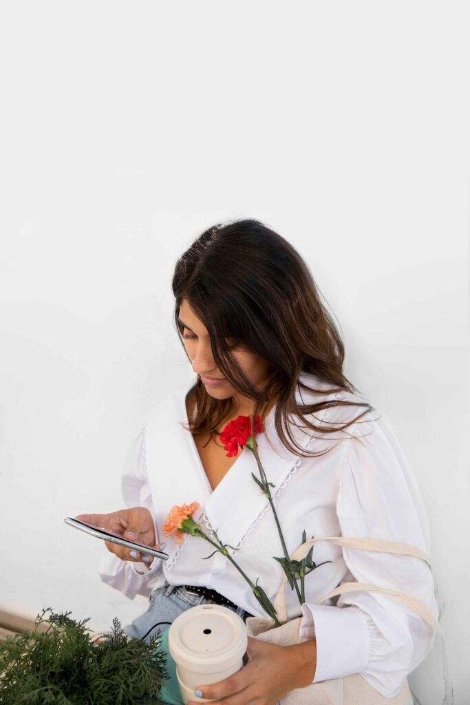 woman using her smartphone and finding the right clinic for sexual health in Canada.